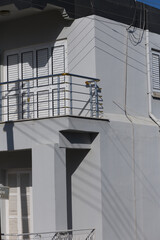 Balcony on a sunny day showcasing architectural details in a vibrant urban setting
