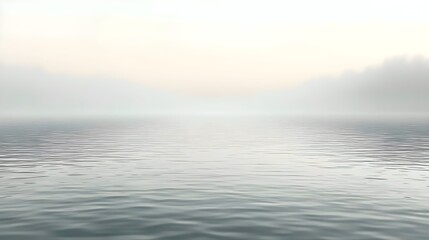 Obraz premium A tranquil scene of a calm water surface reflecting soft pastel hues, enveloped in gentle morning fog, creating a serene and dreamy atmosphere.