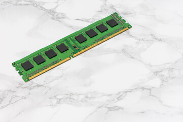 Green computer RAM Sticks sits on a white countertop