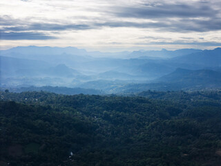Fototapeta premium Majestic mountain landscape under cloudy sky at dawn