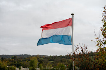 Views of flag of Luxembourg country in Schengen city, place of European Union in autumn