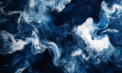Obraz premium Texture of churning waves in shades of deep blue and white hinting at the unpredictable nature of the sea.