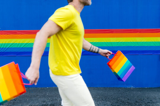 Colorful pride celebration with rainbow-themed shopping bags