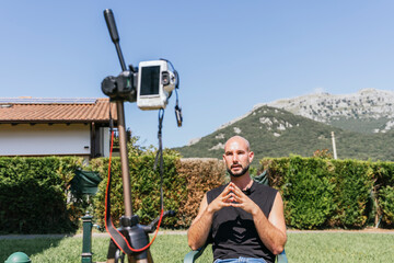 Outdoor video blog recording with camera on tripod