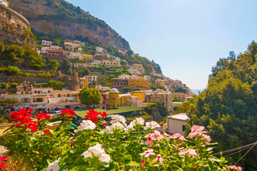 The photo captures a view of Positano, with its colorful, stacked houses cascading down the cliffs,...