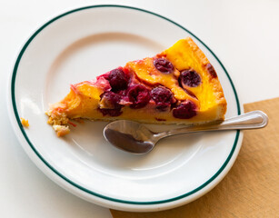 piece of cherry cheesecake on table