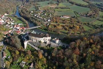 Obraz premium Aerial panorama of Cesky Sternberk Castle a stunning Gothic medieval castle perched on a hill, surrounded by the scenic landscape of the Sazava River valley Bohemia