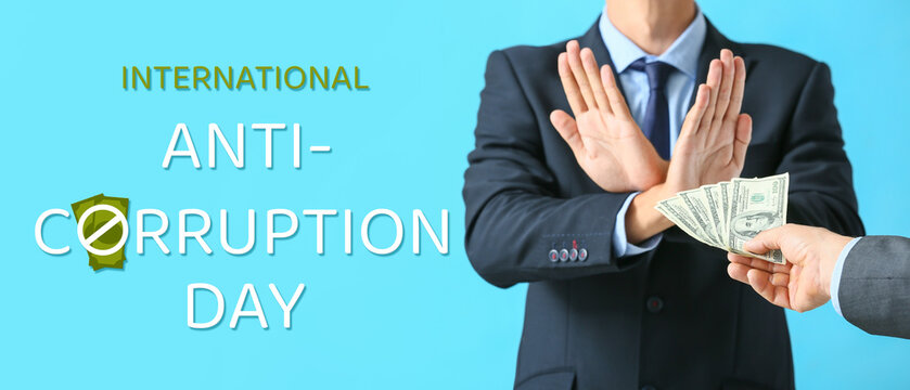 Businessman refusing to take bribe against color background