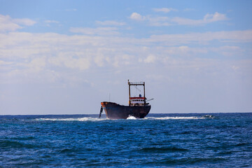 rocky coastline with crashing waves on the island of Cyprus near the shipwreck of the MV Dimitrios...