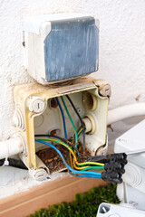 Damaged electrical cable box replaced with new installation in an outdoor setting