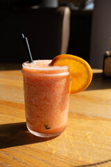 Fresh cocktail with orange and ice. Alcoholic, non-alcoholic drink-beverage at the bar counter in the night club.