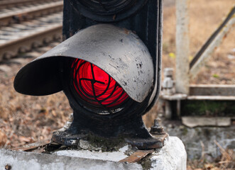 Red traffic light for trains close-up.