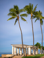 Seascape of Picnic Tables and Benches on a Deserted Stretch of Beach with an Ocean Background.