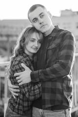 Fototapeta premium Romantic Black and White Embrace of a Young Couple in Casual Attire