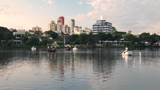Ipago Lake of Londrina city, Parana, Brazil. A beautiful afternoon at the lake with some pedal boats on the water.