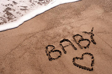 Baby writ on a sand
