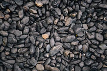 Black stones background - Spa, relax, massage and decoration concepts