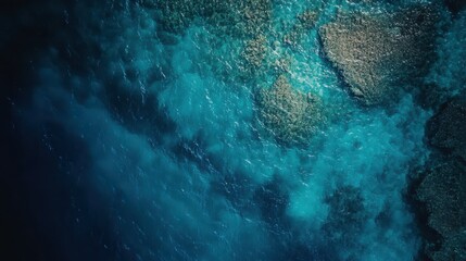 Fototapeta premium Aerial View of Crystal Clear Blue Waters with Coral Reefs and Rocky Outcrops, Showcasing Nature's Beauty and Tranquility Under Soft Sunlight in Tropical Paradise