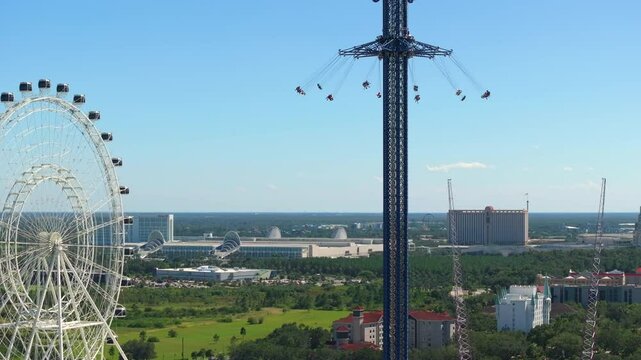 Orlando Starflyer and Ferris observation wheel on International Drive in Orlando, Florida. Attraction for tourists at USA popular travel destination place