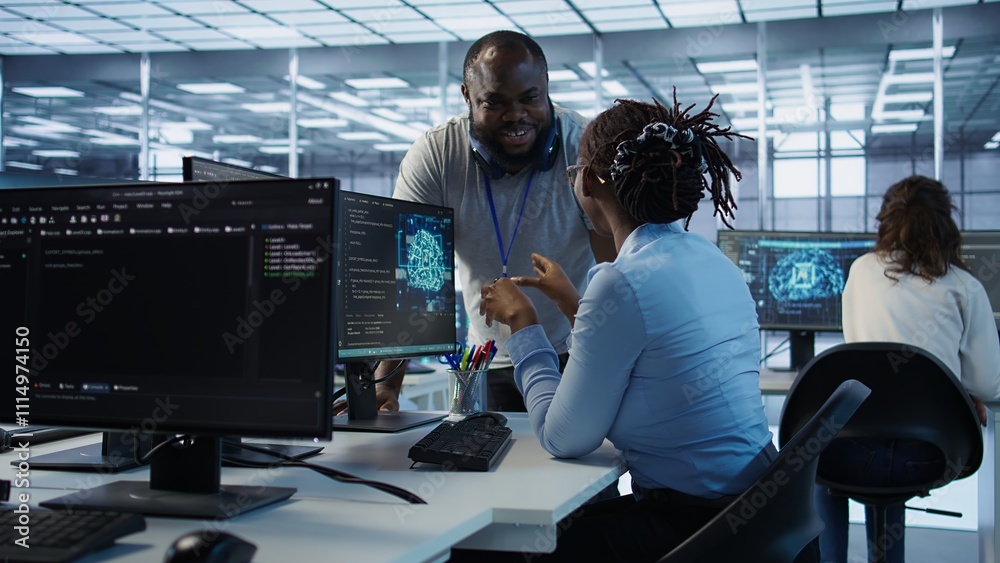 Poster manager doing team meeting with engineers, delegating tasks in high tech data center office. supervi