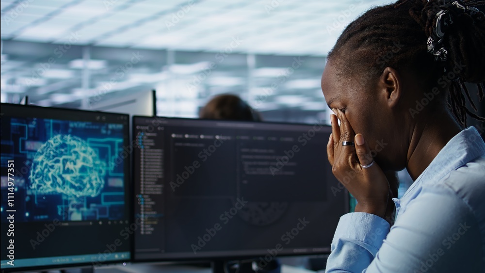 Poster tired software developer having eye strain while working on high tech data center computer. overwork