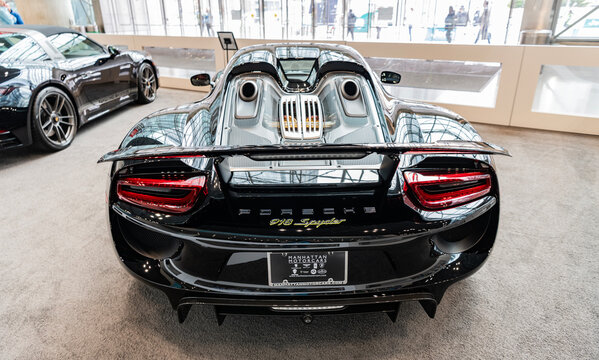 New York City, USA - March 27, 2024: 2015 Porsche 918 Spyder. Luxury Porsche 918 Spyder. Modern Porsche 918 Spyder sportscar at New York International Auto Show, back view