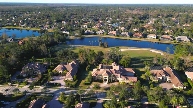Aerial view of row of ultra luxury homes on the golf course in Lake Mary, Orlando, Florida.