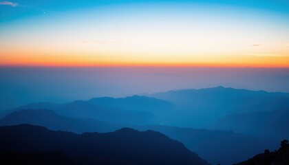 Obraz premium Serene Sunset Over Layered Mountain Ranges