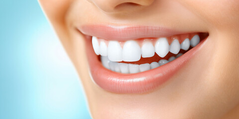 Fototapeta premium Closeup of a smiling woman showing perfect healthy white teeth