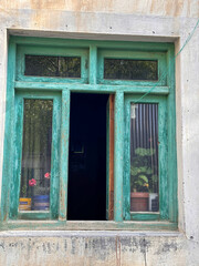 Obraz premium A window with a green frame and a green curtain, Spiti Valley India