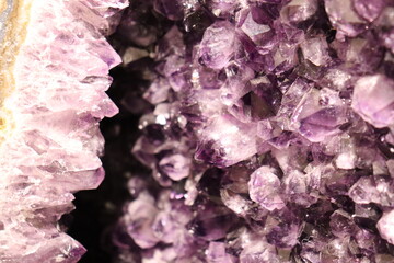 A close-up of a purple geode of amethyst. Mineral, crystal and gemstone and geology. Amethyst druse...