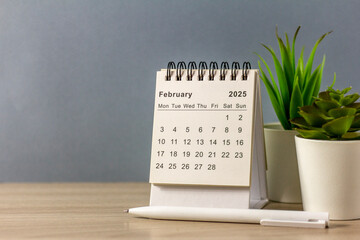 Hello, February 2025. Desk calendar for planning and organizing time.