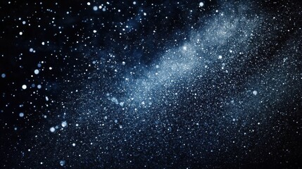 Fototapeta premium Dark blue background with glittering lights, resembling a starry night sky. Ideal for designs needing a cosmic, magical, or dreamy feel.