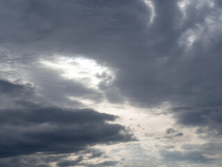 Obraz premium Dark clouds before thunderstorm. Approaching hurricane. Dark stormy sky 