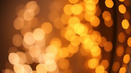 Obraz premium Warm Golden Bokeh Lights: Perfect for Holiday Decorations, Cozy Home Decor, or Festive Backgrounds