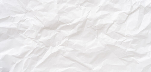 Obraz premium Top view and full frame of wrinkled or crumpled white stencil paper texture used for wrinkled or crumpled white paper background texture in decorative art work