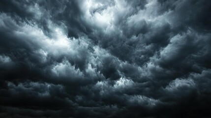 Fototapeta premium Dark, tumultuous clouds create a dramatic sky, suggesting an impending storm.