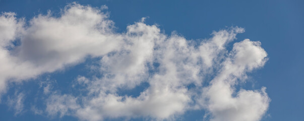 Obraz premium Soft white clouds in blue sky. Panoramic sky background