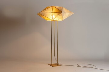 Fototapeta premium A modern decorative lamp with geometric design illuminating a stylish interior space in warm tones