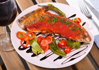 Lamb ribs with hot tomato sauce, roasted chili pepper, balsamic and fresh vegetables