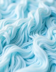 Obraz premium A close-up of soft, fluffy cotton fibers, ready for spinning.