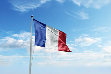 Waving flag of France in blue sky. France flag for Republic Day and Independence Day.