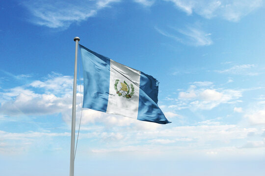 Waving flag of Guatemala in blue sky. Guatemala flag for Republic Day and Independence Day.