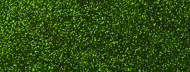 Dark green sparkling background from small sequins, macro. Emerald shiny backdrop with glitter...
