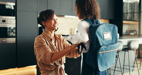 Mom, girl and happy with school uniform in home for preparing or ready for elementary education....