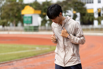 Obraz premium Young Man Jogging on Track Promoting Health and Fitness in Outdoor Setting for Wellness and Active Lifestyle