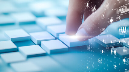 Futuristic hand gesture controlling a digital grid of glowing icons and interactive analytics