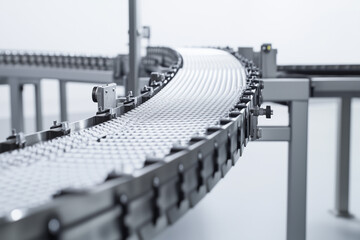 Naklejka premium Selective focus conveyor belt in line production factory isolated on white background, Close up shot conveyor line in industrial factory.