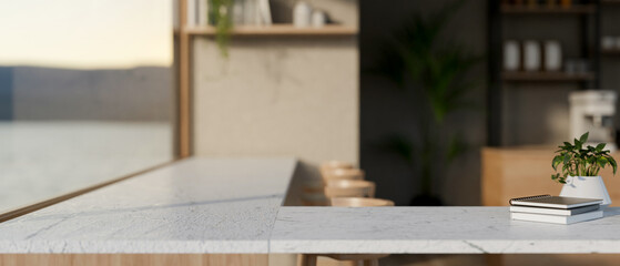 A close-up pf a white corner table against the window in a cozy cafe coffee shop.