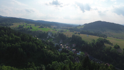 Lush green fields and mountains in rural Poland during summer